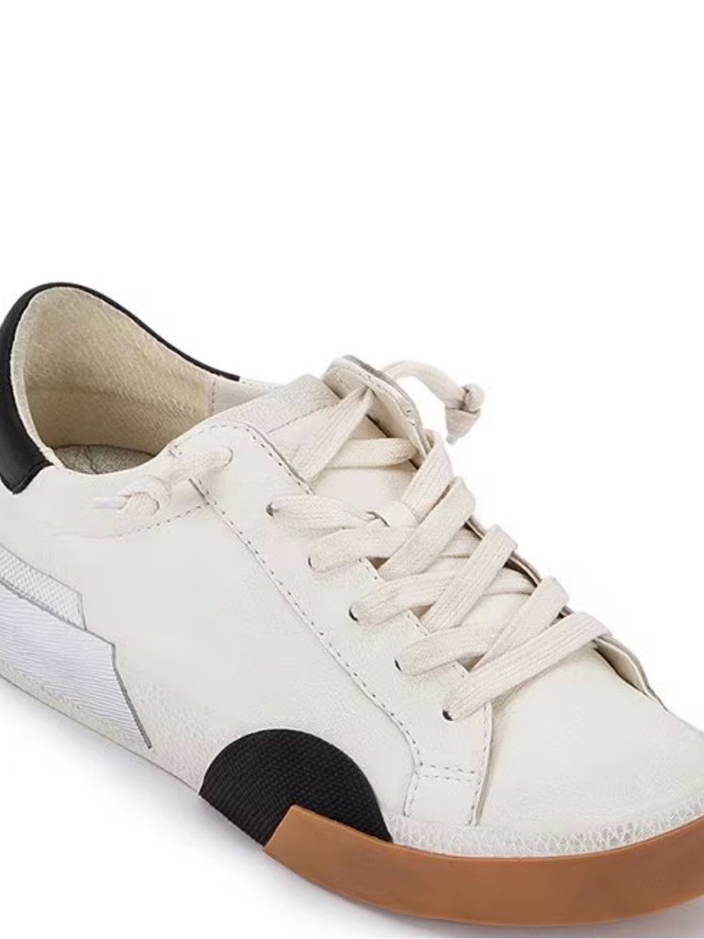 Dolce Vita Womenโs Zina White Leather Sneaker w/Black Heel & Silver Highlights